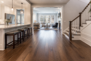 Flooring home value New Jersey — Modern living room with polished hardwood floors and large windows showcasing natural light